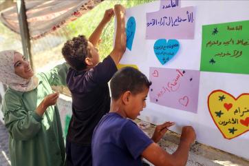 Palestine community members participate in a youth program.