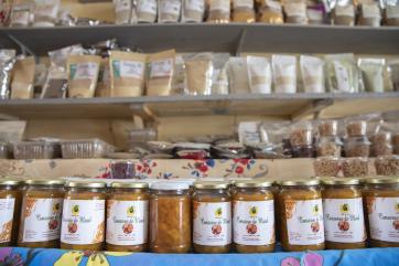Interior shot of store in senegal and a wall of its products.