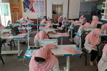 Vocational classroom setting with female students at desks.