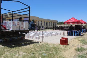 Mercy corps hygiene kits at a distribution location.
